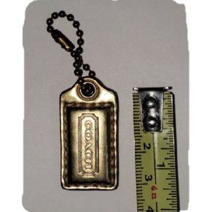 Coach metallic dark gold 1-1/2 inch Genuine Leather hang tag lozenge MINI